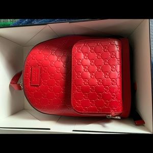 Red authentic gucci backpack.